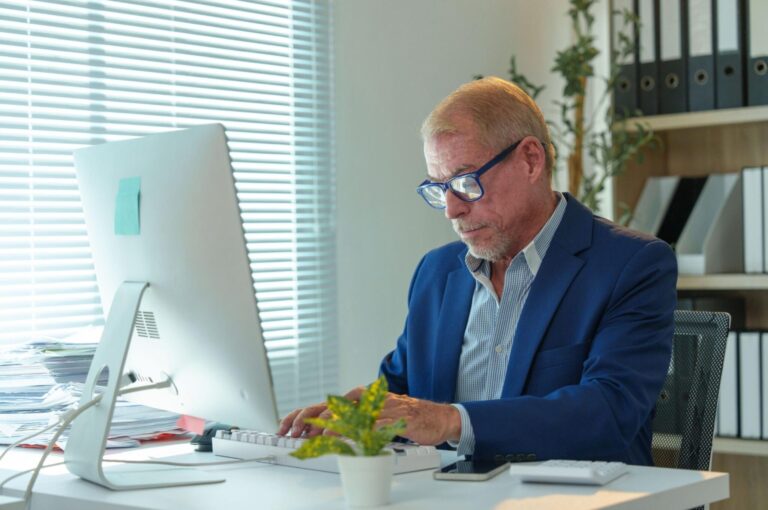 A man working at an office desk.