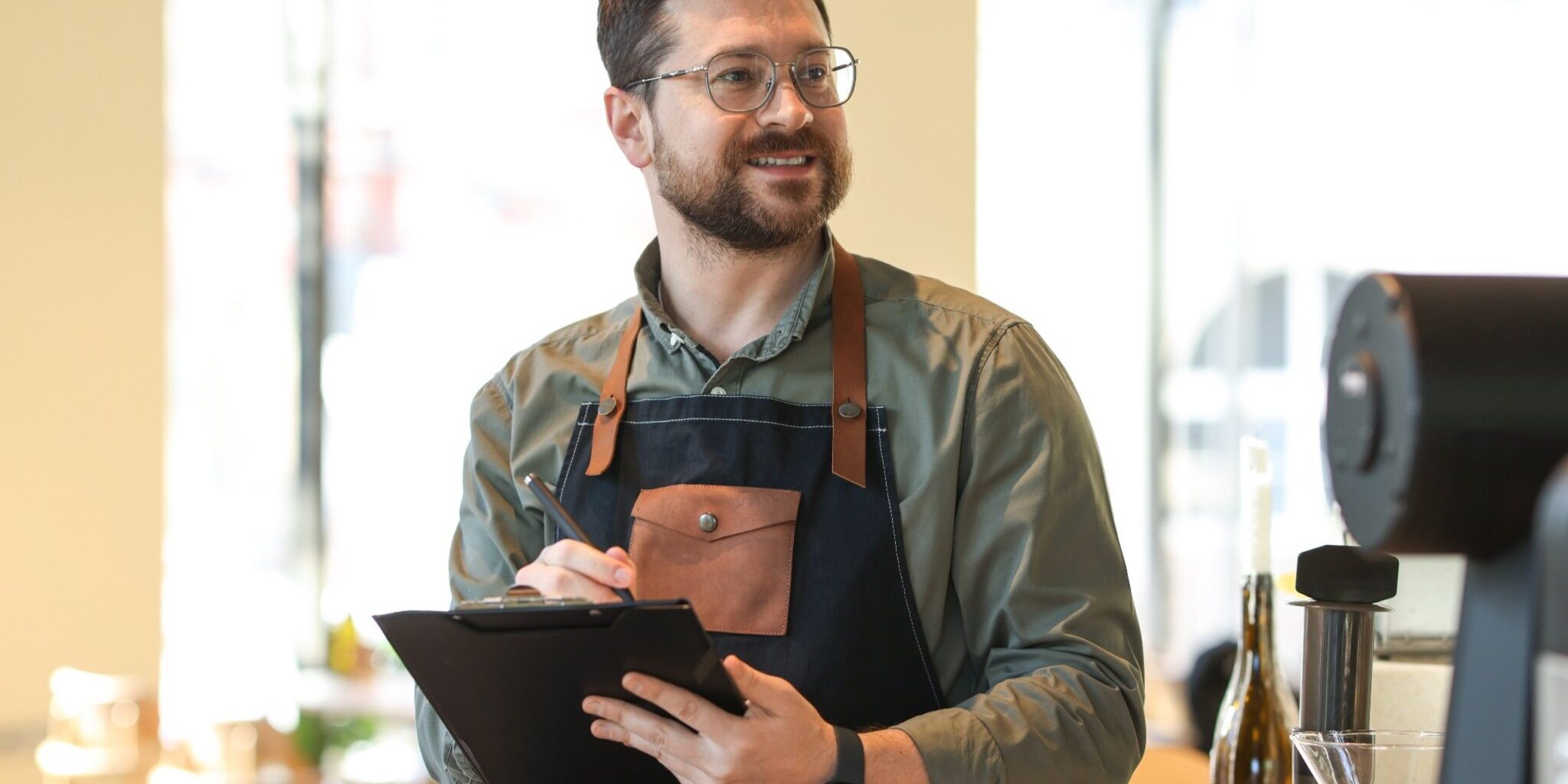 A business owner with a clipboard inspecting work.